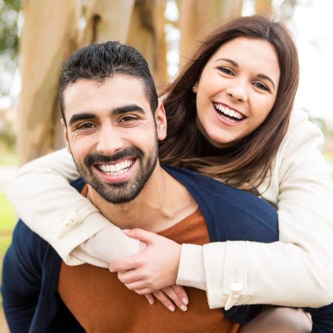 Lovely couple hugging each other in the city